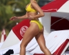 Singer Dua Lipa Wears A Yellow Bikini As She Takes A Dip In The Ocean With Her Sister In Miami, Then Greets Her Boyfriend On The Sand