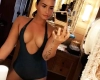 Demi Lovato Shows Off Her Cleavage in Plunging Swimsuit