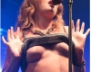 Tove Lo flashes her bare breasts